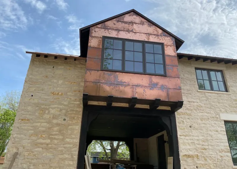 Copper metal panel facade on a stone building for Roof Repair in Camp Pendleton Mainside